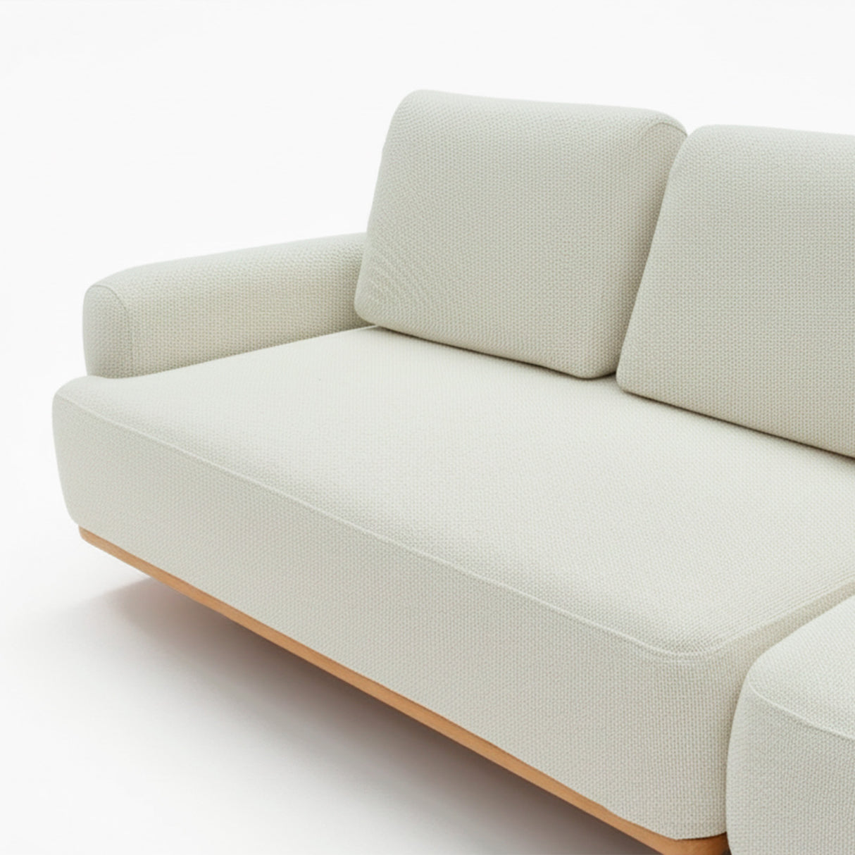Sofá de dos cuerpos con pouf del lado derecho y mesa de madera