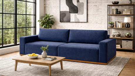 Sofá Imperial azul en living industrial con detalles en madera y luz natural (1)