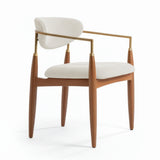 Silla acolchada de madera con brazo de acero colorvainilla claro.