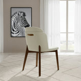 Silla acolchada con respaldo y patas de madera y detalle en ecocuero.