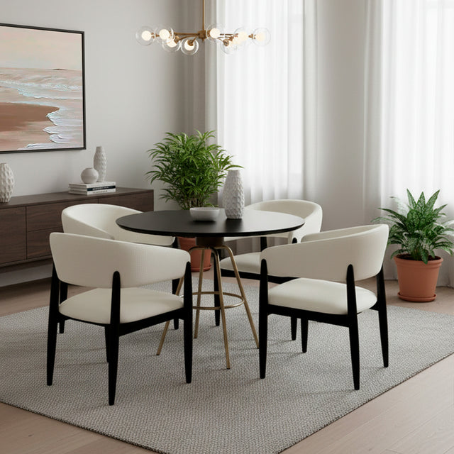 Set de mesa de comedor circular color negro con juego de cuatro sillas color blanco.