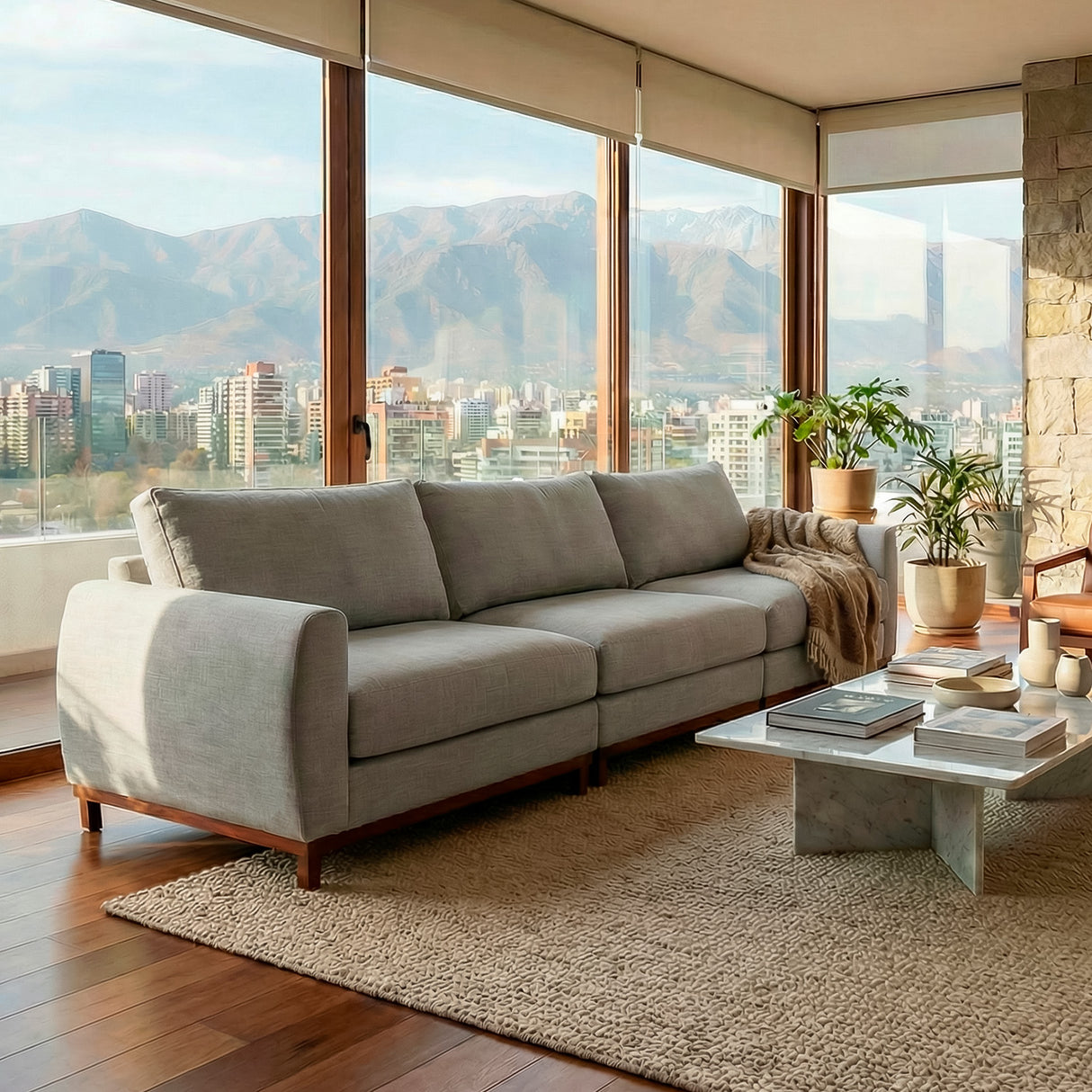 Sofá de tres cuerpos en tela lino color gris.