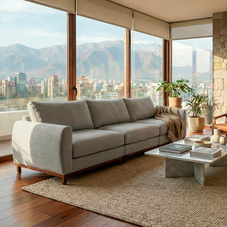 Sofá de tres cuerpos en tela lino color gris.