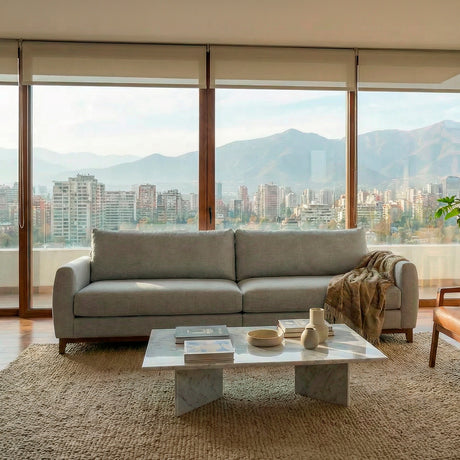 Sofá de dos cuerpos en tela lino color gris.