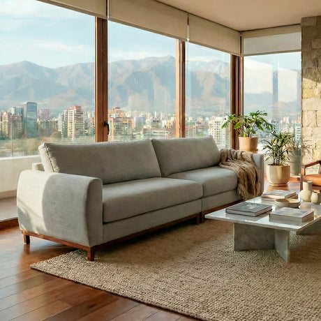 Sofá de dos cuerpos en tela lino color gris.