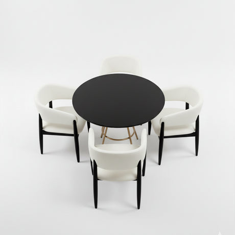 Set de mesa de comedor circular color negro con juego de cuatro sillas color blanco.